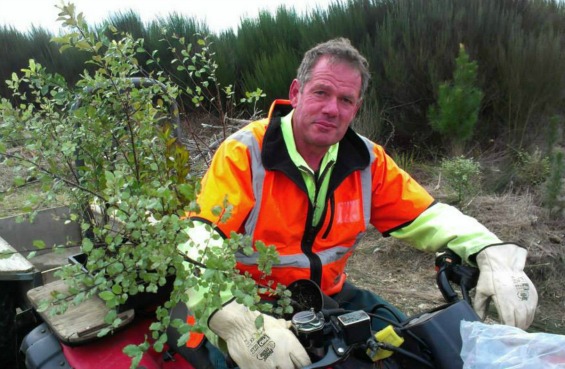 Bike Taupo track builder Bruce Jaine, out doing some restoration planting. 