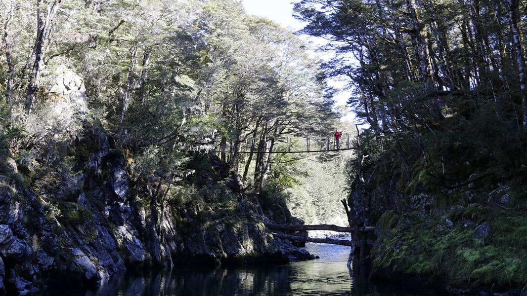 Swing bridge over river.