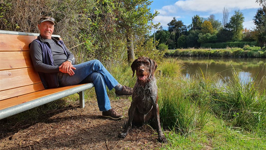 Michel Dedual at the mouth of the Tauranga-Taupō River with his dog Bracken. 