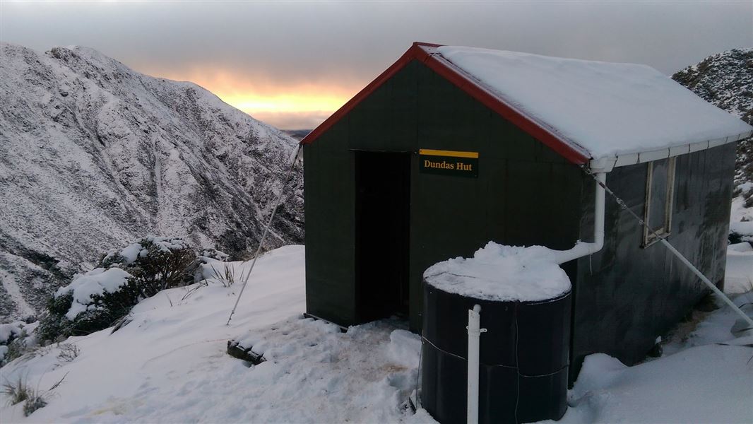 Dundas Hut covered in snow. 