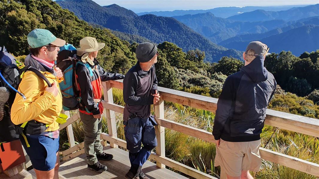 Trampers on the deck of Moonlight Hut.