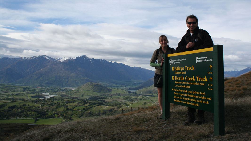 People with Atleys Track sign. 