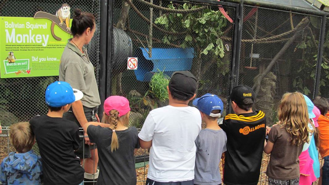 Guide and children at Brooklands Zoo. 