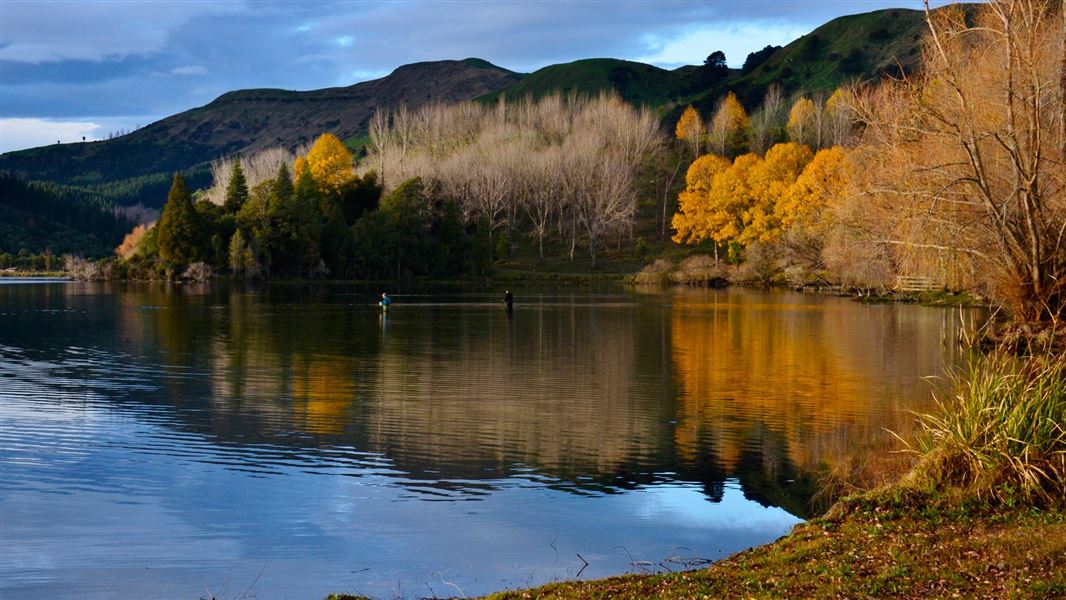 People fishing at Lake Tutira, Hawke's Bay. 