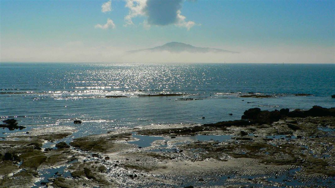 Fog surrounds Rangitoto Island. 