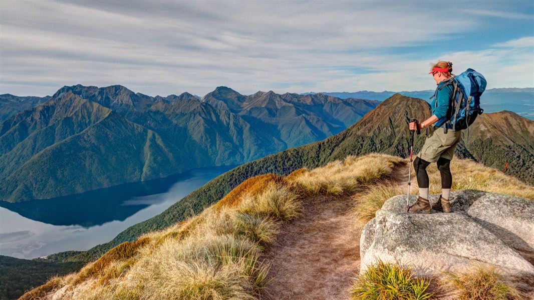 Tramper looking down to Lake Te Anau from the Kepler Track.