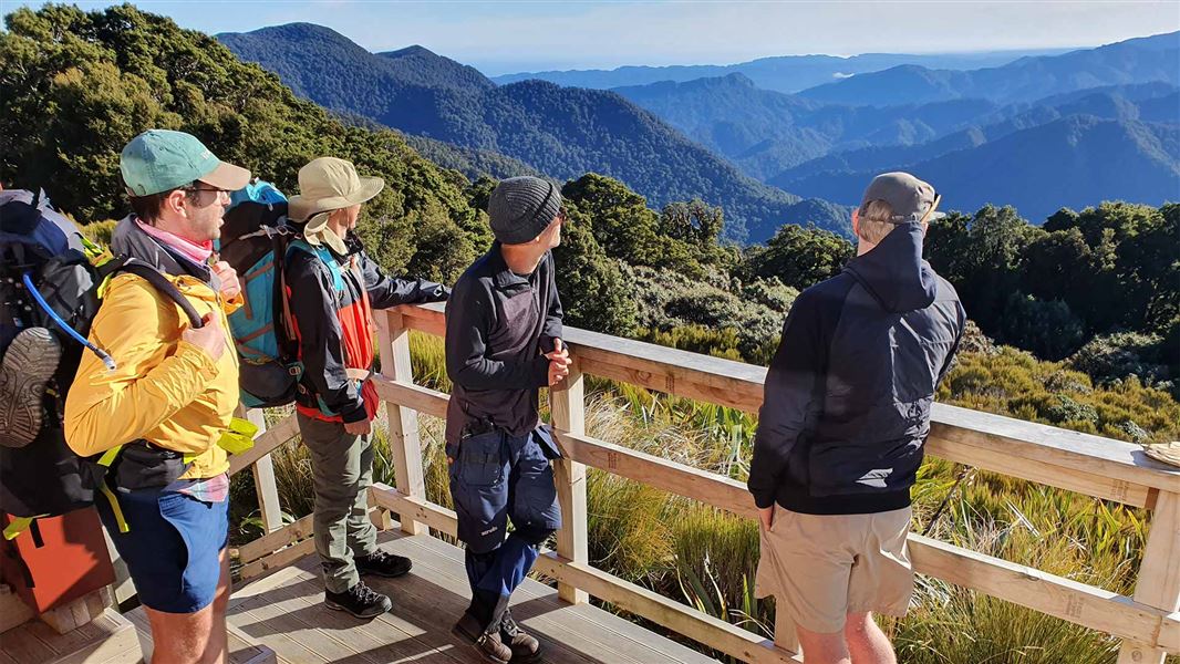 Taking in the view from Moonlight Tops Hut, Paparoa Great Walk