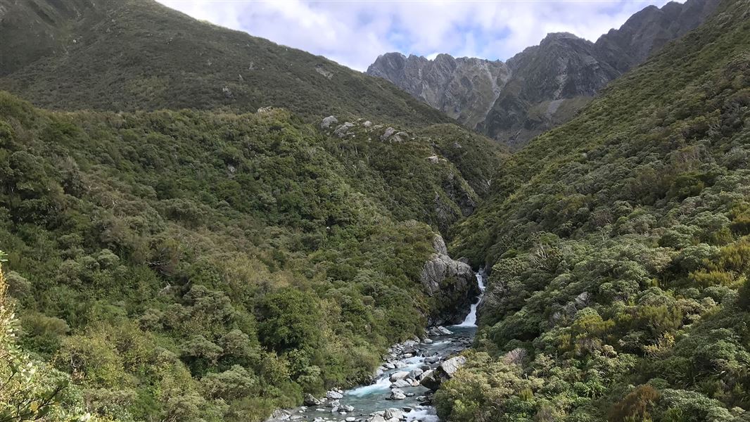 Rocky river in valley.