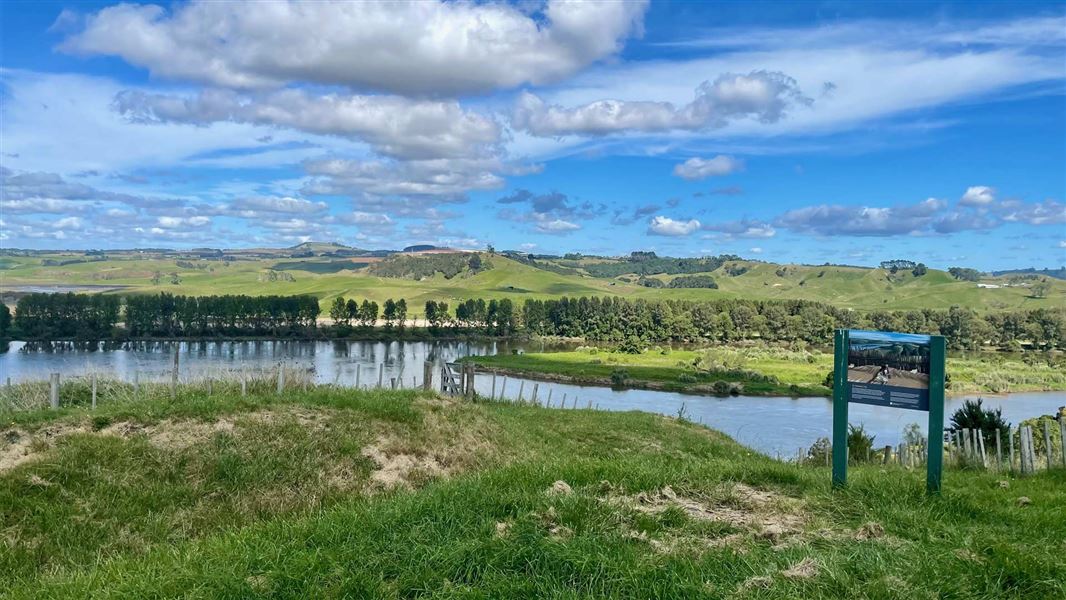 View across river over to farmland.