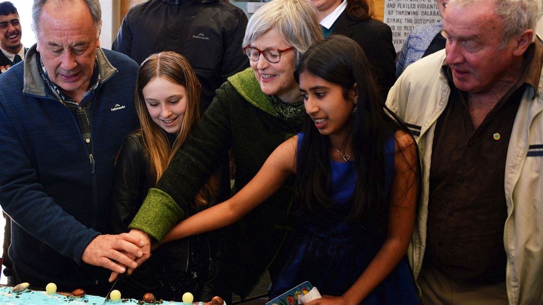 Cutting the cake at the Taputeranga Marine Reserve celebrations. 