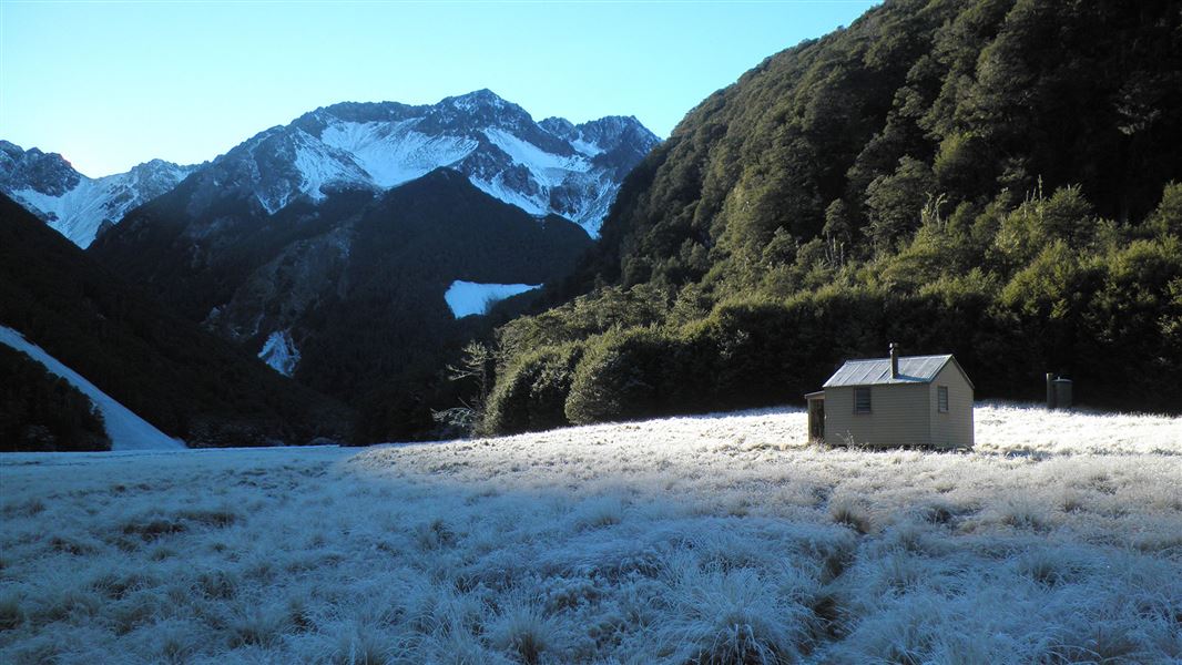 Small building near mounatin.