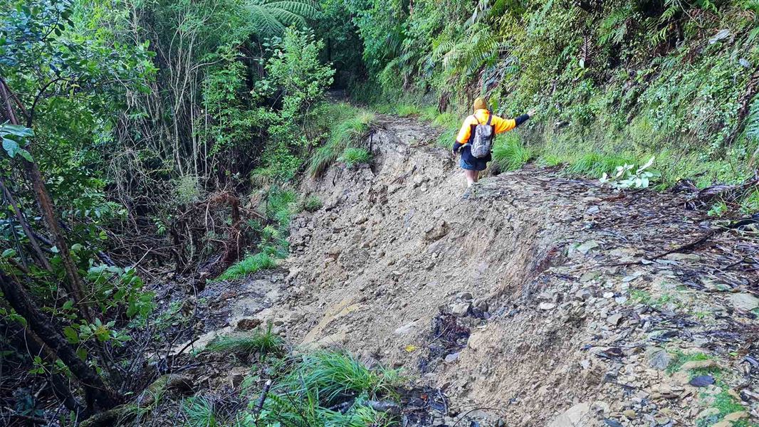 A rough track that is mostly slide away down the side of the hill. No access way through.