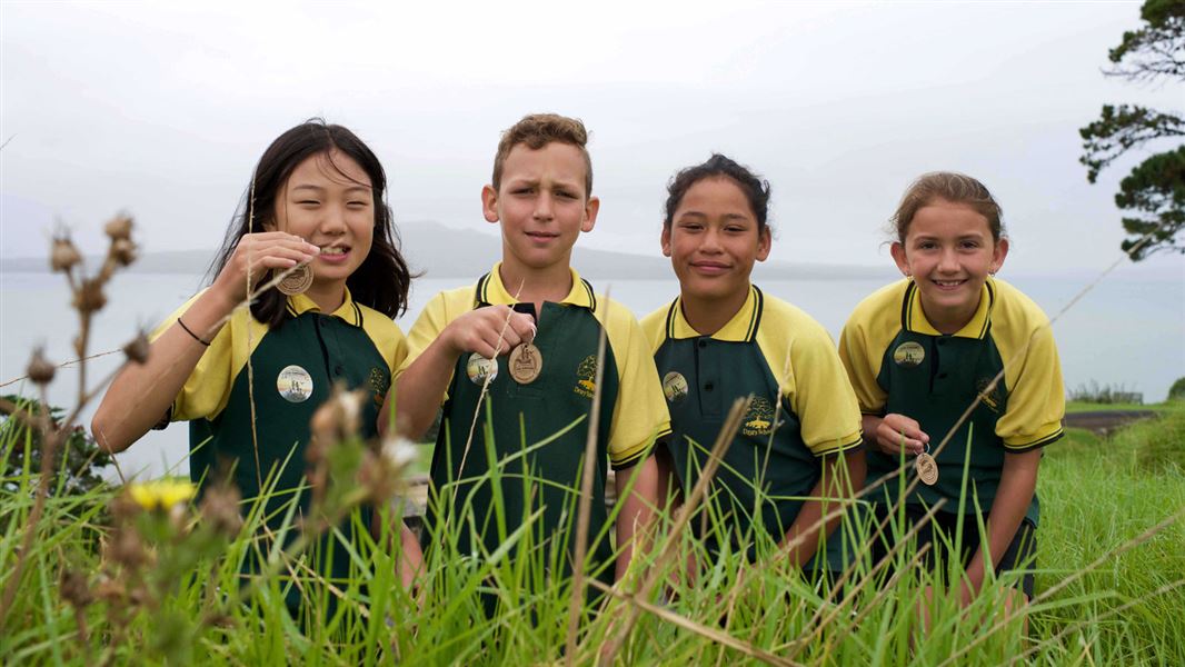 Kids with kiwi guardians medals. 