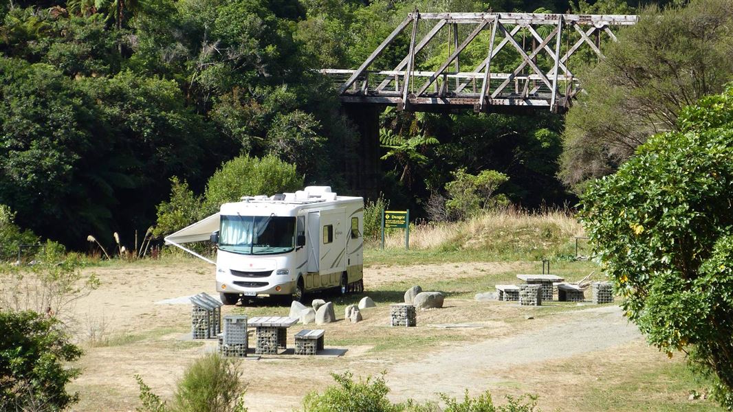 Camp beside one of the few remaining historic Howe truss bridges. 