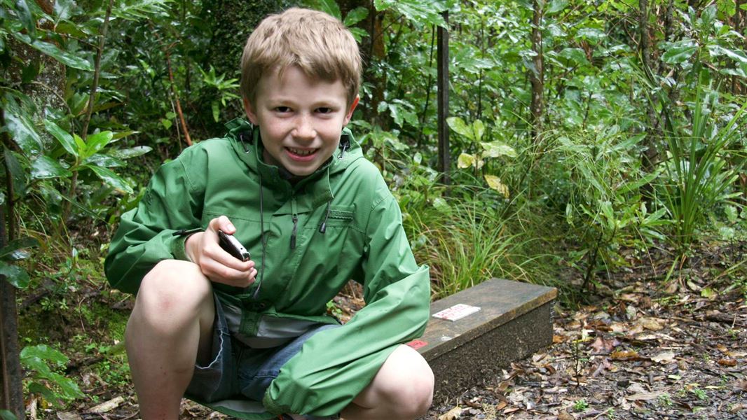 Boy geocaching. 