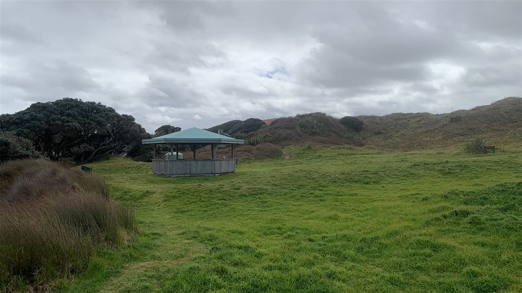 Pavillion in grassy area.