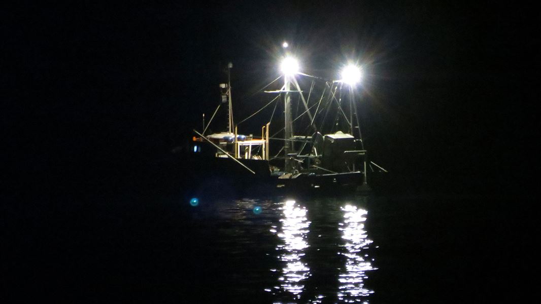 Boat at sea during the night. 