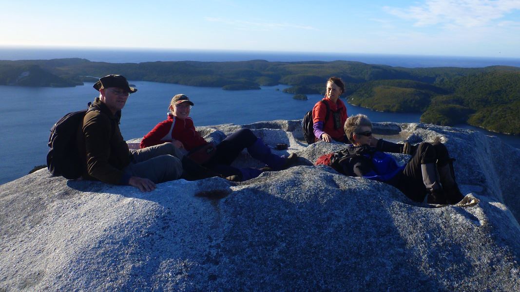 People sitting on top of Bald Cone. 