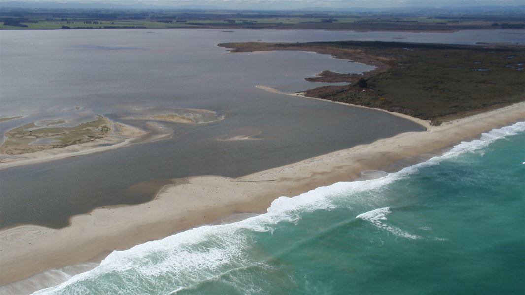 An aerial photo taken over looking Waituna Lagoon