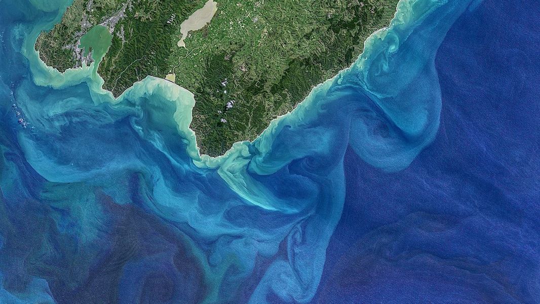 A satellite image taken of the bottom of the South Island of New  Zealand, to show the ocean.