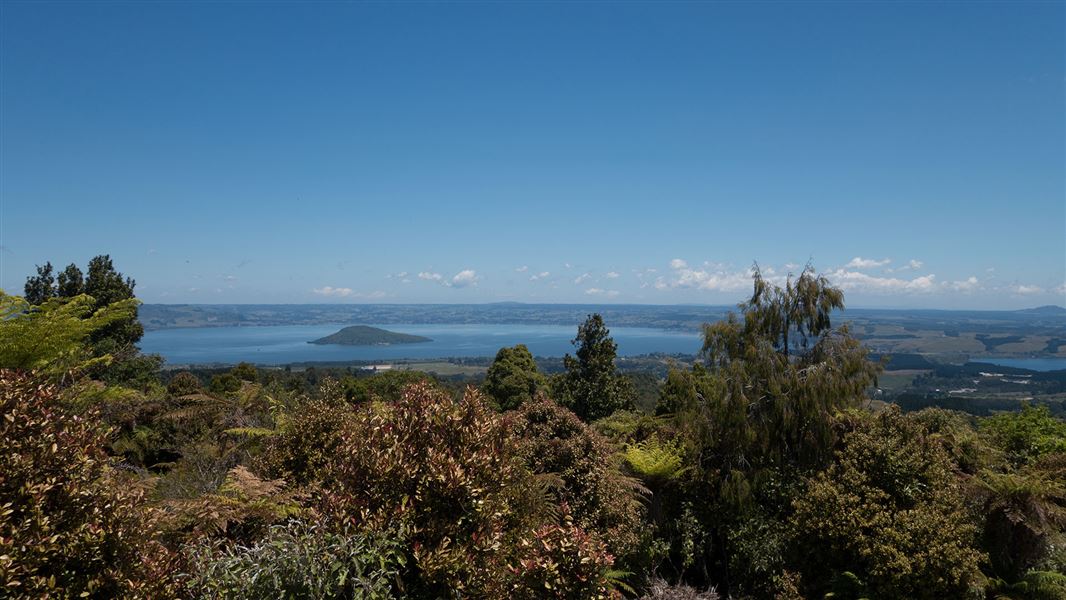 View of lake with trees in front.