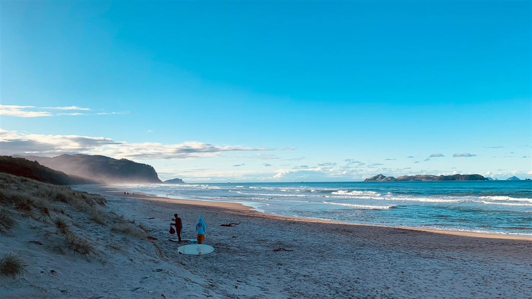 White sand beach with the sun starting to set. 