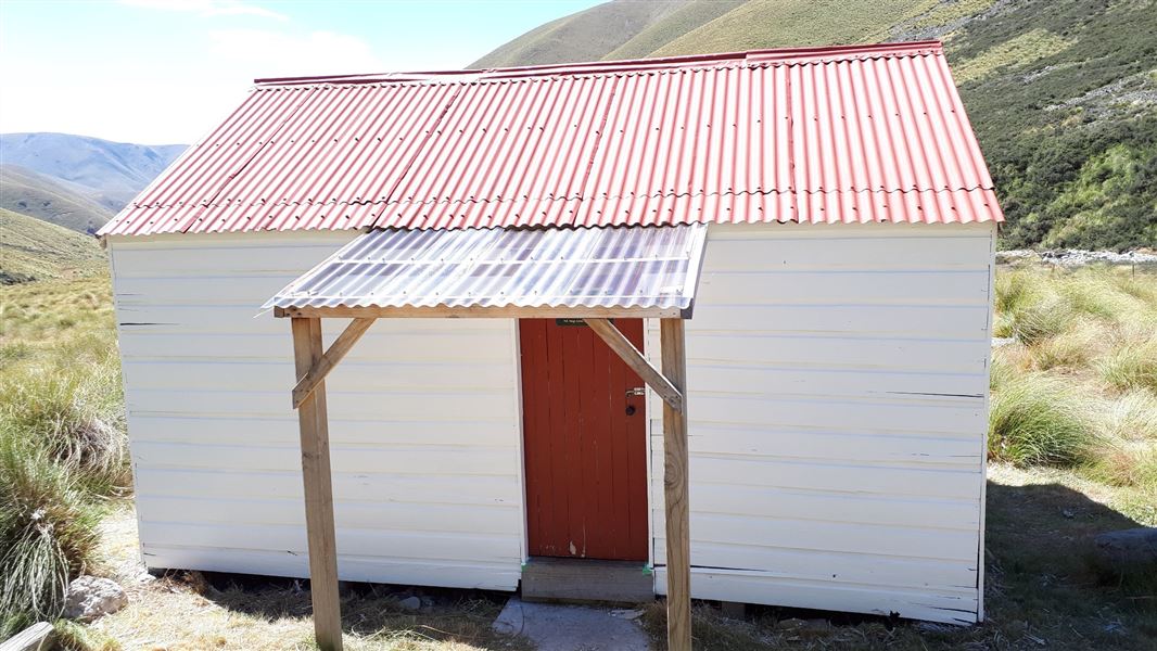 Small hut in grassy area