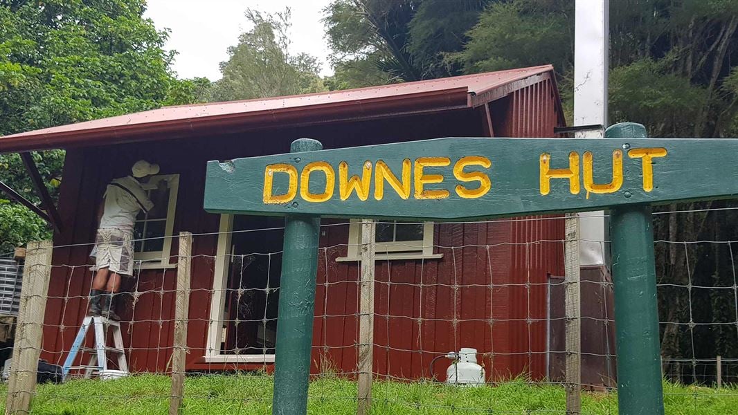 Bob Anderson painting Downes Hut. 