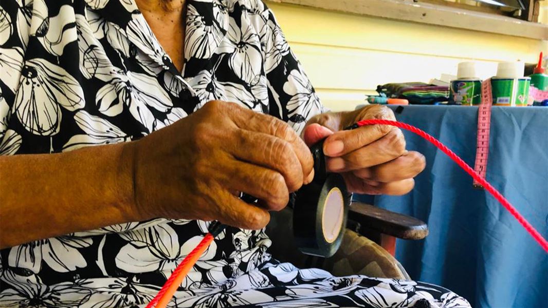 Fijian women making a bird scaring line