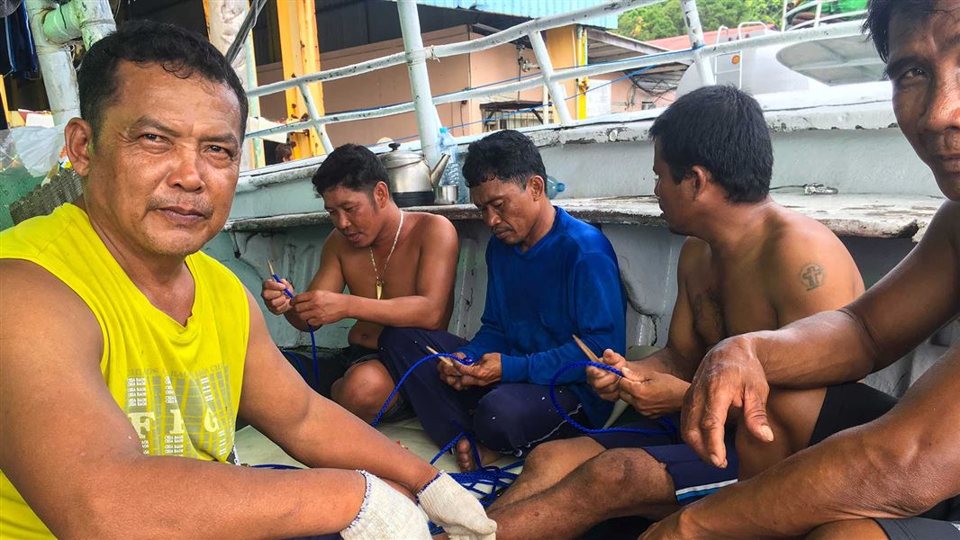 Crew on fishing boat. 