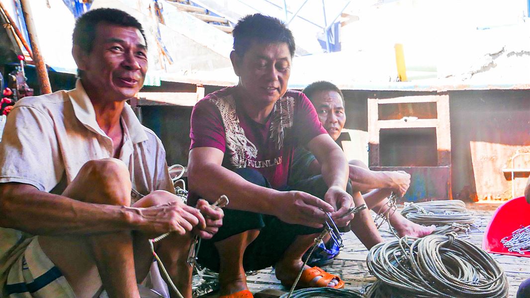 Crew on fishing boat. 