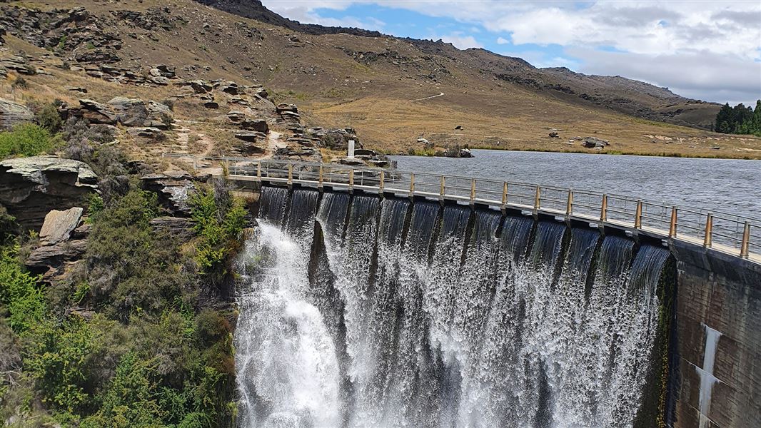 Dam near hills.